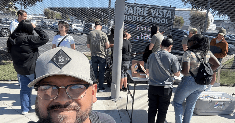 David Urquhart (on the left, in the back) and Jeffte Villalta (front, facing the camera) minister at Prairie View Middle School.
