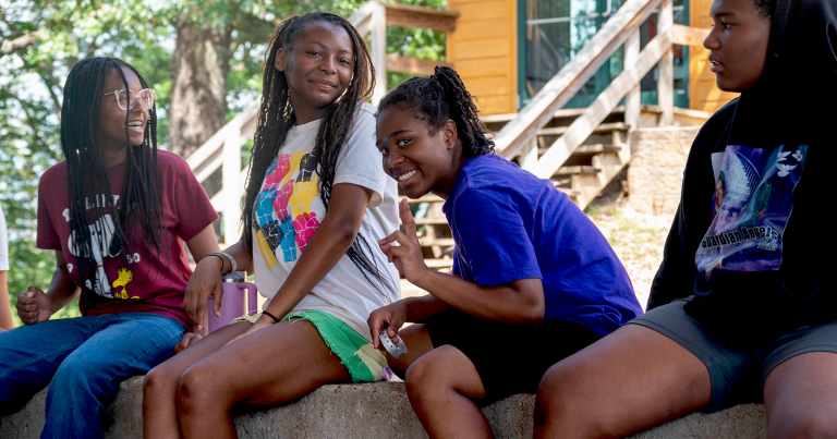 ic-blog-25-09a-header Halle, Zina, Jocelyn, and Bruce rest during camp.