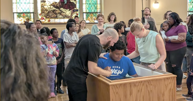 Fernando is baptized at New Life Center in 2024 by his mentor, Pastor Isaac Huffman, and Jessica Quigley, director of The Vine.